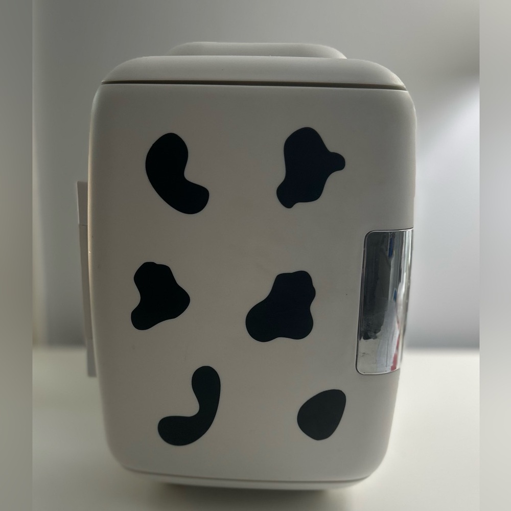 Cow print mini fridge in good condition.